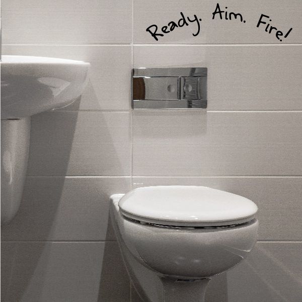 Toilet wall decal reading "Ready. Aim. Fire!" in a curved layout
