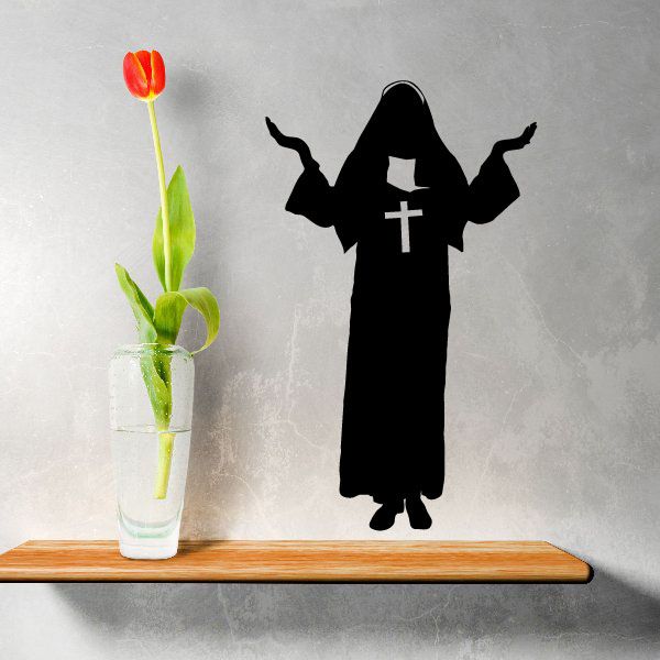 Black nun silhouette wall decal with cross and flowing dress