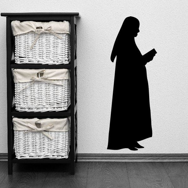 Nun silhouette decal of a robed figure holding a book, black