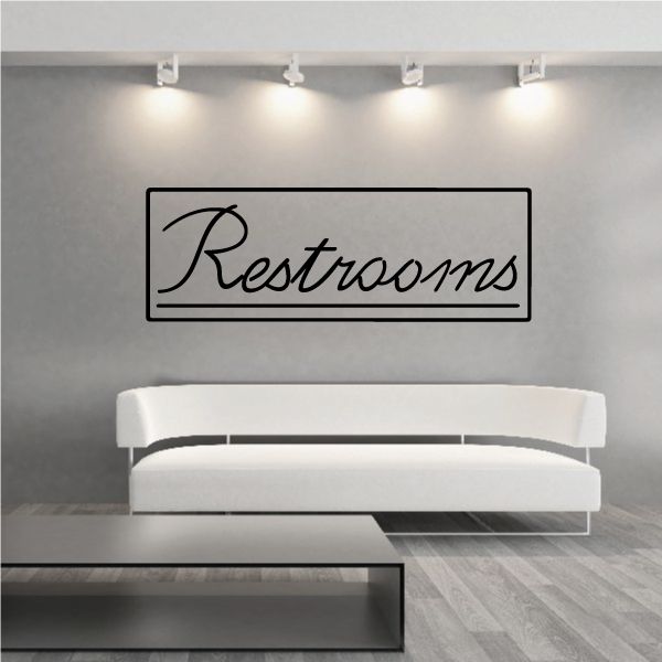 Restrooms wall decal with black script text in outlined rectangle
