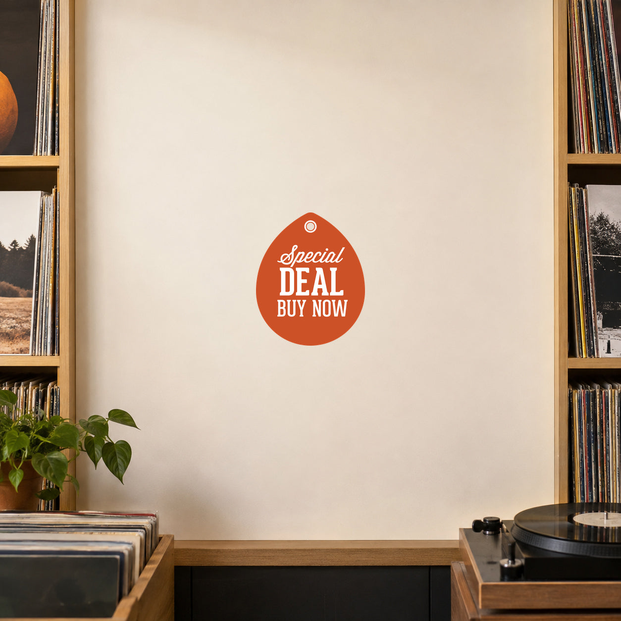 Special Deal Buy Now Retail Discount Sign Sticker applied in A blank smooth matte ivory sale display panel inside a record shop, vinyl sleeves and turntable only extreme edges, frontal photo.