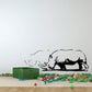 Black rhino grazing wall decal with dust cloud and grass accents