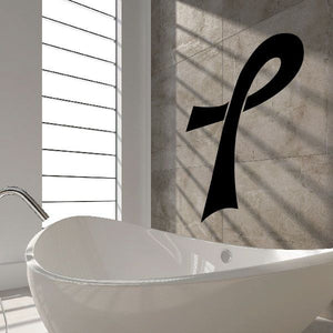 Long thin ribbon decal, black loop and tail on wall