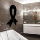 Black awareness ribbon decal on tiled wall