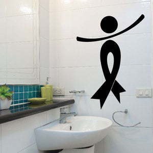 Black awareness ribbon person decal on wall above sink with curved arm