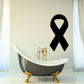 Black awareness ribbon decal on wall above a clawfoot bathtub