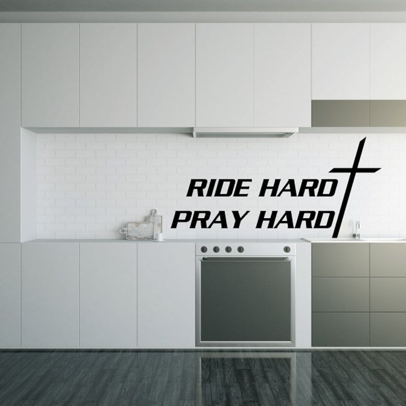 Black wall decal: “RIDE HARD / PRAY HARD” with cross symbol