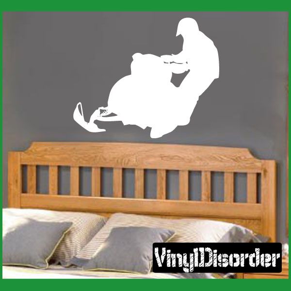 Snowmobile rider decal, white silhouette on dark backing