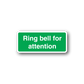 Green attention bell sticker with white text and rounded white border