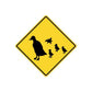 Yellow road sign vinyl sticker with black dog and chicks silhouettes