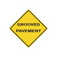 Road sign wall decal, yellow diamond with black border and text 'GROOVED PAVEMENT'