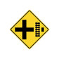 Yellow road sign decal with black cross and construction barrier icon
