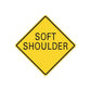 Yellow diamond road sign sticker with black border and text "SOFT SHOULDER"