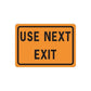 Orange road sign decal sticker with black border: 'USE NEXT EXIT'.