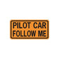 Road sign vinyl sticker: 'PILOT CAR FOLLOW ME' black text on orange
