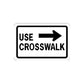 Road sign wall decal sticker with USE CROSSWALK text and right arrow, black and white.