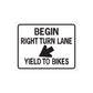Road sign vinyl decal with text BEGIN, RIGHT TURN LANE, YIELD TO BIKES and left arrow