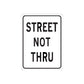 Road sign wall decal with black border and text 'STREET NOT THRU'.