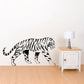 Tiger wall decal with black-and-white stripes, roaming side profile.