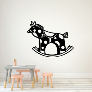 Rocking horse wall decal in black with white polka dots and curved rocker base