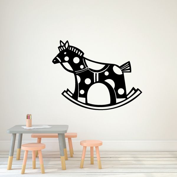Rocking horse wall decal in black with white polka dots and curved rocker base