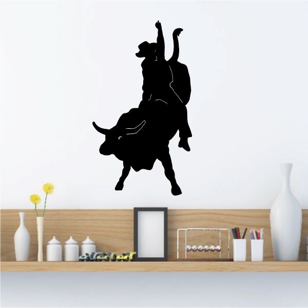 Rodeo bull riding wall decal, black silhouette of rider on bucking bull