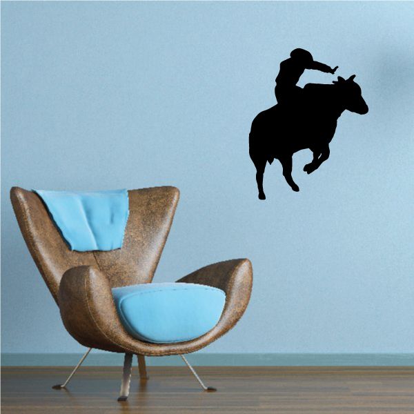 Rodeo bull riding wall decal with black rider and bull silhouette