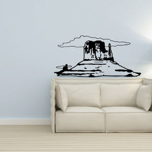 Cowboy hat and boots vinyl wall decal, black outline on light wall