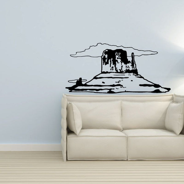 Cowboy hat and boots vinyl wall decal, black outline on light wall