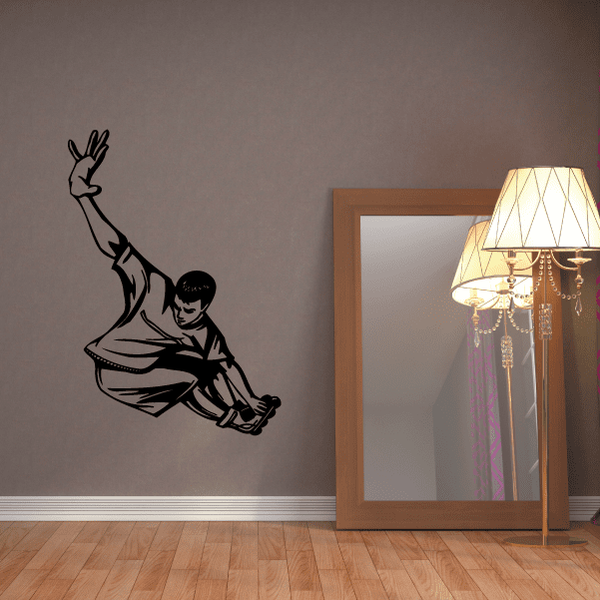 Black rollerblading wall decal showing a skater mid-ride with bent knees and arm raised