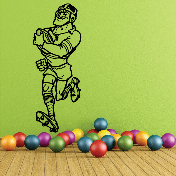 Rugby player wall decal holding a ball with black outline