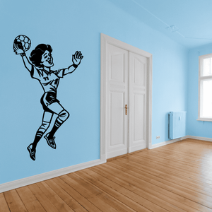 Rugby player wall decal showing a black silhouette tossing a ball in midair