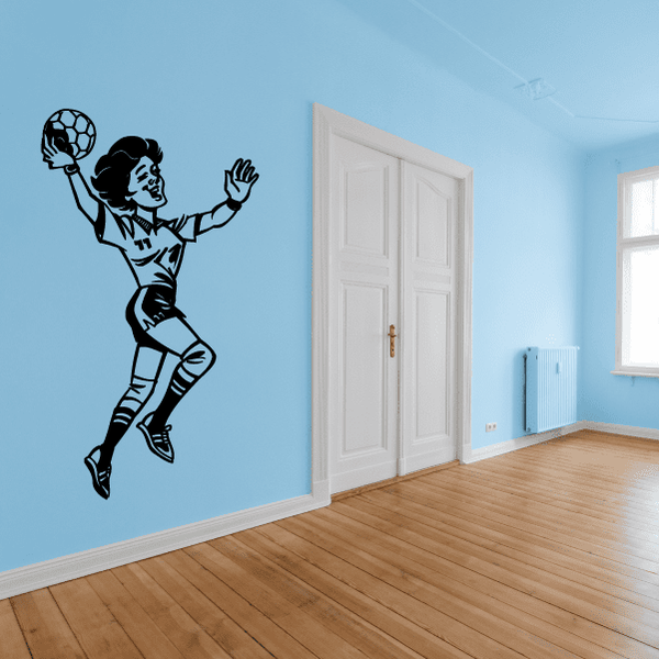 Rugby player wall decal showing a black silhouette tossing a ball in midair
