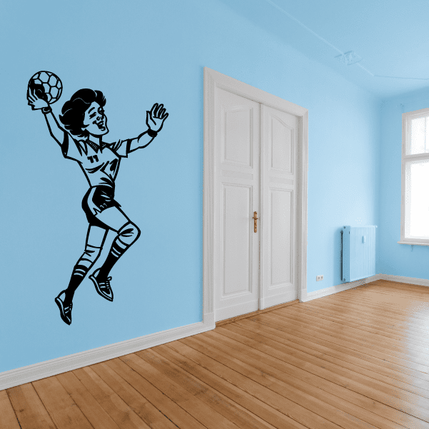 Rugby player wall decal showing a black silhouette tossing a ball in midair