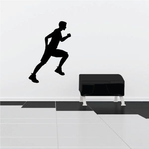 Black runner silhouette wall decal in a running pose with bent arms and legs