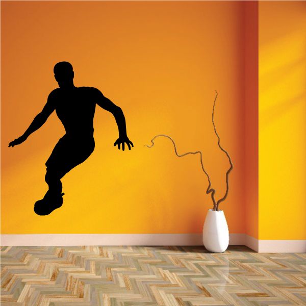 Black running figure wall decal in dynamic motion pose silhouette