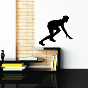 Vinyl wall decal of a black runner sprinting, silhouette style