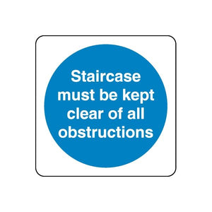 Safety sign decal: blue circle with white text, 'Staircase must be kept clear of all obstructions'
