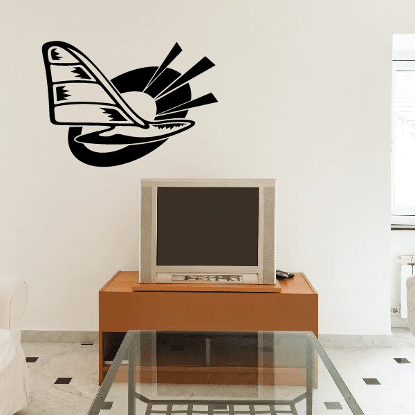 Black sailboat vinyl wall decal with white sail and curved waves