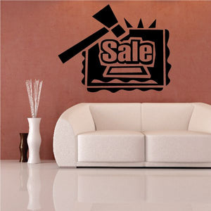 Black wall decal with “Sale” sign and arrow accents