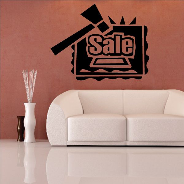 Black wall decal with “Sale” sign and arrow accents
