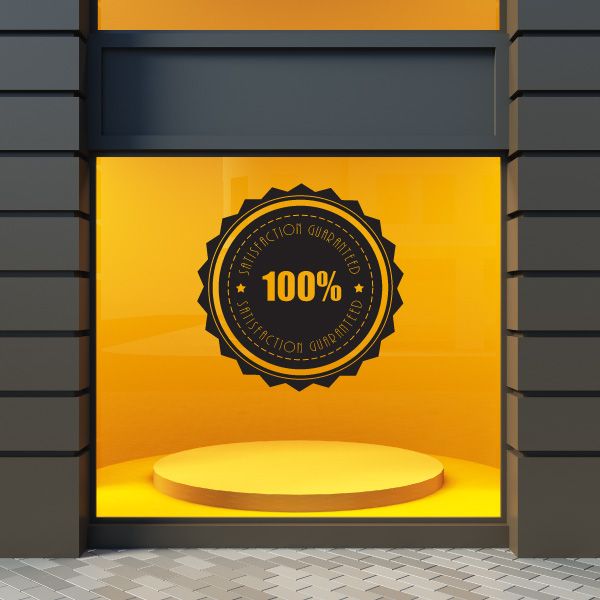 Circular vinyl wall decal with black 100% badge and Satisfaction Guaranteed text