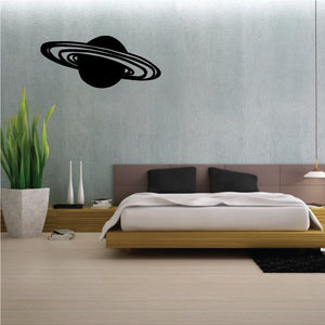 Saturn rings decal featuring a black planet with curved ring design