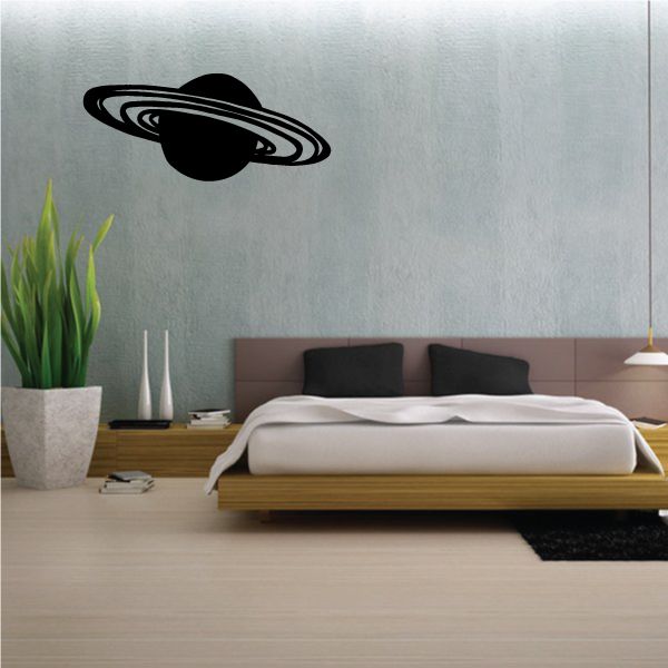 Saturn rings decal featuring a black planet with curved ring design