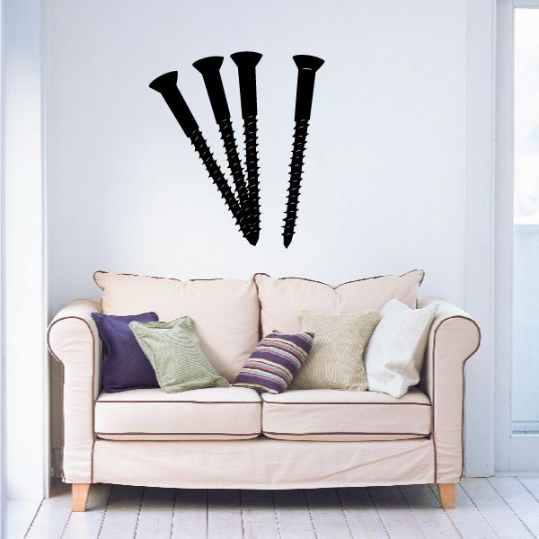 Screws decal featuring three black screws on wall