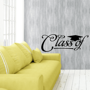 Black script wall decal reading “Class of” on a gray wall above a yellow sofa