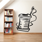 Sewing needle and thread wall decal of a hand-drawn thread spool with needle