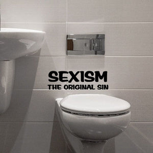 Bathroom wall decal: 'SEXISM THE ORIGINAL SIN' text beside toilet