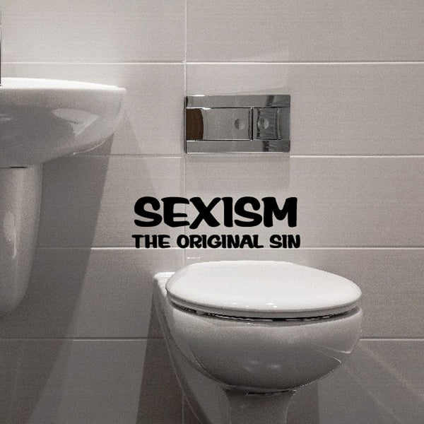 Bathroom wall decal: 'SEXISM THE ORIGINAL SIN' text beside toilet