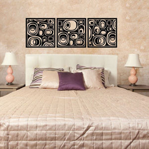 Three-panel abstract oval wall decal set with black and cream circular swirls.